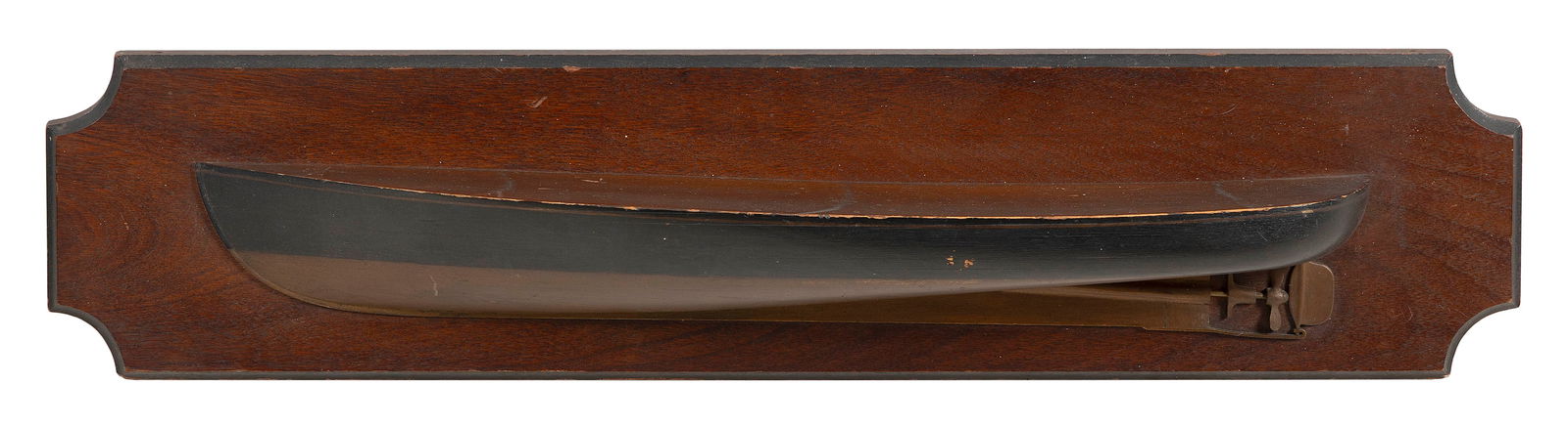 MOUNTED HALF HULL MODEL OF A MOTOR BOAT Early 20th Century Backboard 7" x 33".: MOUNTED HALF HULL MODEL OF A MOTOR BOATEarly 20th CenturyBlack hull with bronze-colored bottom.Backboard 7" x 33".
