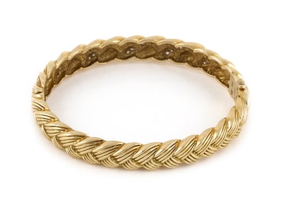 18KT YELLOW GOLD AND DIAMOND BANGLE BRACELET Approx. 27.8 total dwt.