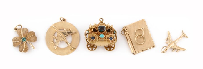 FIVE YELLOW GOLD CHARMS 18kt approx. 9.2 dwt., 14kt approx. 13.2 dwt.