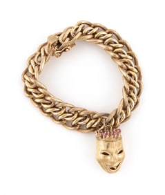 14KT YELLOW GOLD CHARM BRACELET WITH A RUBY AND SAPPHIRE CHARM Approx. 30.5 total dwt.