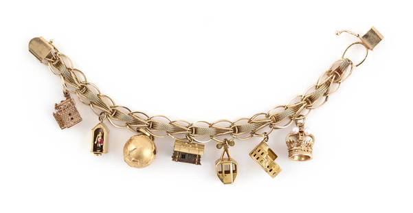 14KT YELLOW GOLD CHARM BRACELET WITH 14KT AND 18KT YELLOW GOLD CHARMS Approx. 32.5 total dwt.: 14KT YELLOW GOLD CHARM BRACELET WITH 14KT AND 18KT YELLOW GOLD CHARMSFancy link chain bracelet with three 14kt charms and four 18kt charms. Box clasp with fold-over safety. Bracelet stamped. Charms st