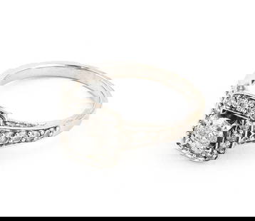 14KT WHITE GOLD AND DIAMOND RING Approx. 3.0 total dwt.: 14KT WHITE GOLD AND DIAMOND RINGOne approx. 0.33 ct. diamond and 24 small round-cut diamonds, approx. 0.25 ctw. Size 8?.Approx. 3.0 total dwt.