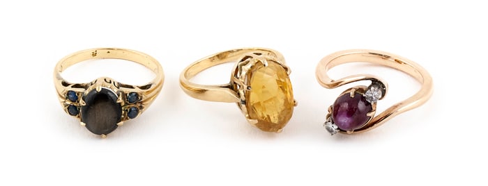 THREE GOLD AND STONE RINGS Approx. 8.6 total dwt.