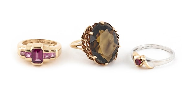 THREE GOLD RINGS WITH STONES Approx. 8.2 total dwt.