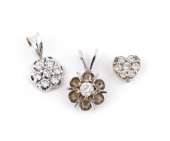 THREE 14KT WHITE GOLD AND DIAMOND PENDANTS Approx. 1.5 total dwt.