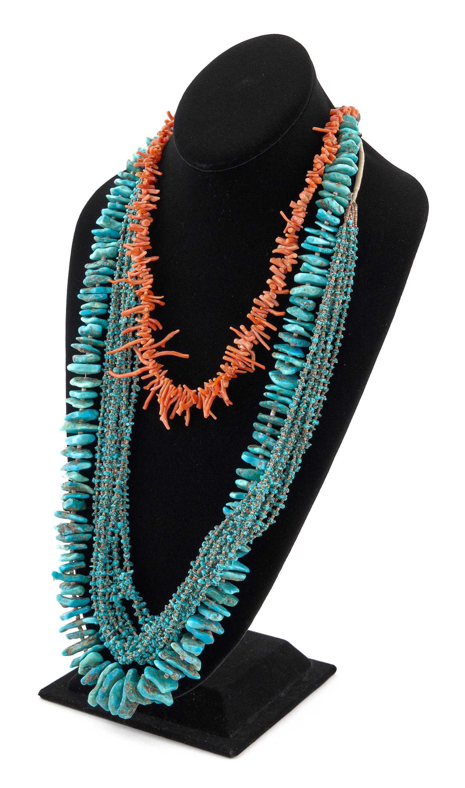 THREE NAVAJO TURQUOISE AND CORAL NECKLACES Early to Mid-20th Century: THREE NAVAJO TURQUOISE AND CORAL NECKLACES Early to Mid-20th Century 1) Graduated turquoise nuggets, heishi shell beads and silver cones. Length 33". 2) 10 strands of small turquoise nuggets, heishi s