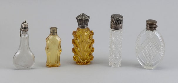 FIVE SCENT BOTTLES WITH STERLING SILVER STOPPERS Mid-19th Century/Mid-20th Century Heights from