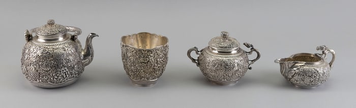 KONOIKE STERLING SILVER FOUR-PIECE TEA SET Japan, Meiji Period Approx. 44.1 troy oz.