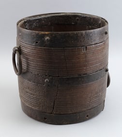 EARLY IRON-BOUND WOODEN BUCKET Probably England, 18th Century Height 10.5". Diameter 10.25".