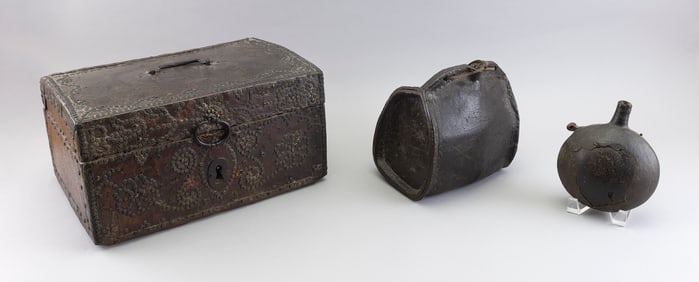 THREE EARLY LEATHER-COVERED ITEMS 18th Century or Earlier Box height 8". Width 16.75". Depth 10.5".