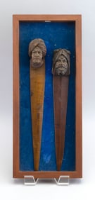TWO CARVED WOODEN PAGE TURNERS Early 20th Century Page turner lengths approx. 15". Framed 20" x