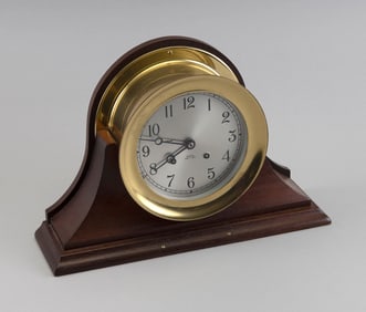 CHELSEA SHIP'S BELL CLOCK Boston, 20th Century Face diameter 5.25". Case diameter 7.25". Stand