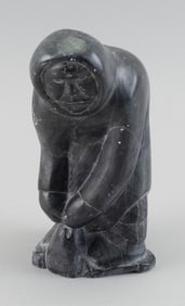 KAPIK PUDLAT CARVED SOAPSTONE FIGURE OF A HUNTER Kinngait (Cape Dorset), Nunavut, 1952- Height 8".