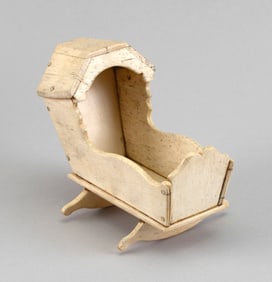 MINIATURE WHALEBONE HOODED CRADLE 19th Century Height 5". Length 6.25".