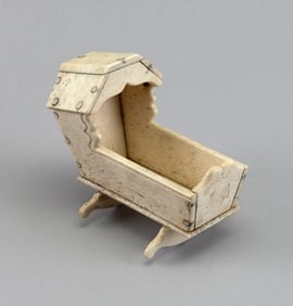 MINIATURE WHALEBONE HOODED CRADLE 19th Century Height 4.5". Length 6". Width 3.75".