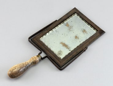 HAND MIRROR WITH TURNED WHALEBONE HANDLE 19th Century Length 11.5". Width 5.5".
