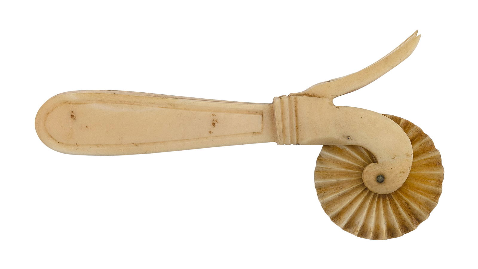 WHALE IVORY PIE CRIMPER 19th Century Length 5.5".: WHALE IVORY PIE CRIMPER19th CenturyIncised handle with primitive repair. Fluted wheel.Length 5.5".
