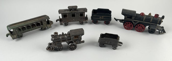 SIX CAST IRON TOY TRAINS First Quarter of the 20th Century Lengths from 3.25" to 7.25".