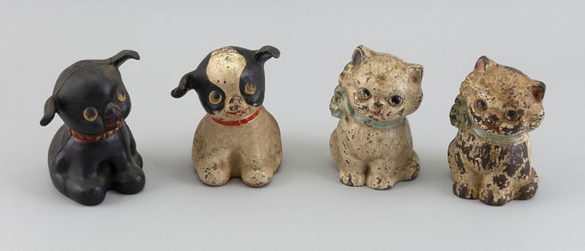 FOUR ANIMAL-FORM CAST IRON STILL BANKS Early 20th Century Heights approx. 5".