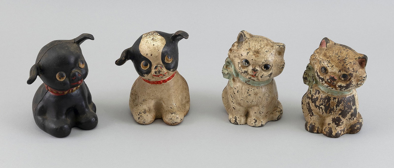 FOUR ANIMAL-FORM CAST IRON STILL BANKS Early 20th Century Heights approx. 5". (1 of 3)