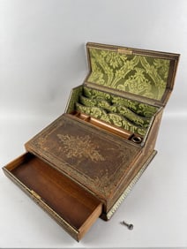 GILT TOOLED LEATHER-COVERED MAHOGANY WRITING SLANT Late 19th Century Height 8.75". Width 15.5".