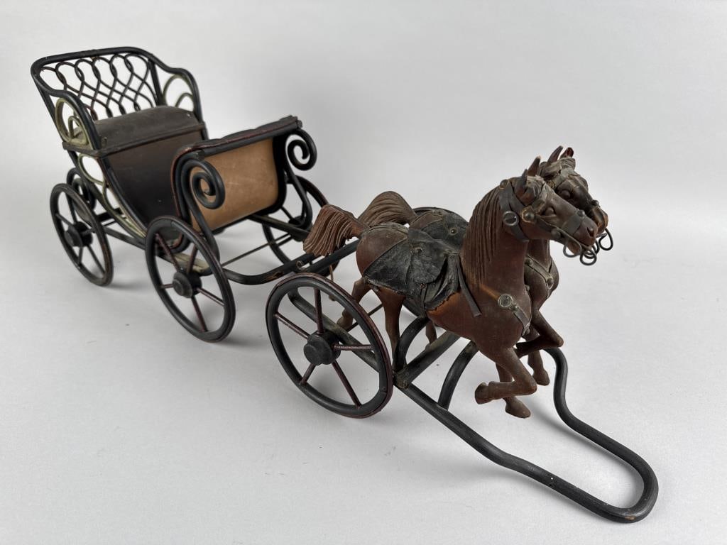 MINIATURE HORSE-DRAWN WAGON 20th Century Length 20.5".: MINIATURE HORSE-DRAWN WAGON20th CenturyCarved wooden horses. Bent rattan, cardboard and leather carriage and chassis.Length 20.5".