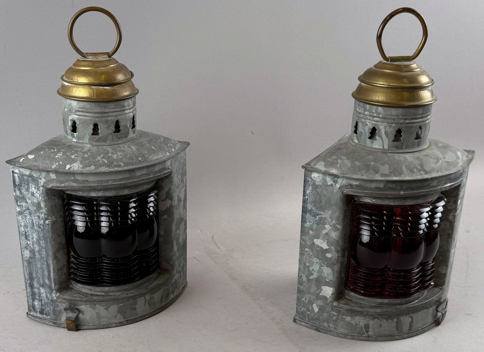 PAIR OF PORT LANTERNS Mid-20th Century Heights 12".: PAIR OF PORT LANTERNS Mid-20th Century Galvanized metal with brass caps. Heights 12".