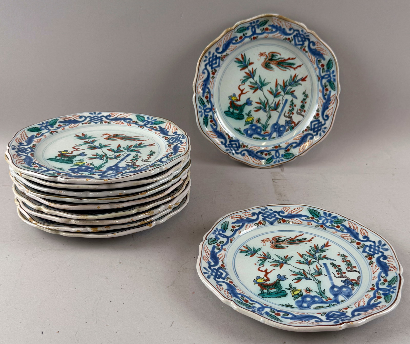 SET OF ELEVEN ITALIAN TIN GLAZED PLATES 20th Century Diameters 9.25".: SET OF ELEVEN ITALIAN TIN GLAZED PLATES 20th Century Blue, red, yellow and green Chinoiserie decoration. Diameters 9.25".