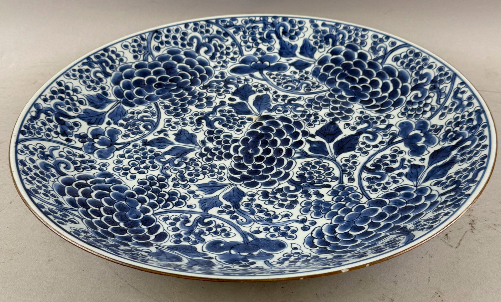 CHINESE BLUE AND WHITE PORCELAIN CHARGER Late 19th Century Diameter 15.5".: CHINESE BLUE AND WHITE PORCELAIN CHARGER Late 19th Century Floral decoration. Diameter 15.5".