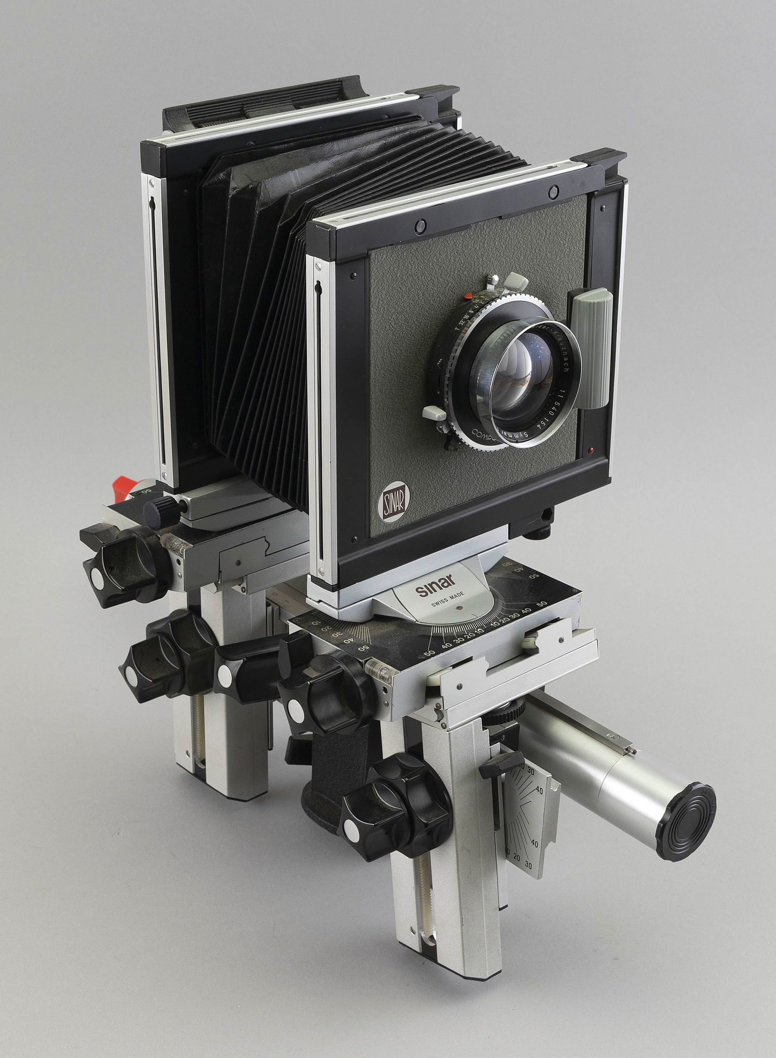 SINAR P 4X5 VIEW CAMERA WITH CASE AND ACCESSORIES Camera length 18.5". Case 11.5" x 24" x 15".: SINAR P 4X5 VIEW CAMERA WITH CASE AND ACCESSORIESSerial #10154. Sinar lens board with Schneider-Kreuznach Symmar 1:5.6 210mm lens, Serial #11540154. Hard-sided fitted case contains extra bellows, extr