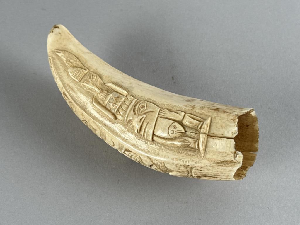 NORTHWEST COASTAL CARVED WHALE'S TOOTH 19th Century Length 6".: NORTHWEST COASTAL CARVED WHALE'S TOOTH 19th Century Totemic designs on all sides. Length 6".