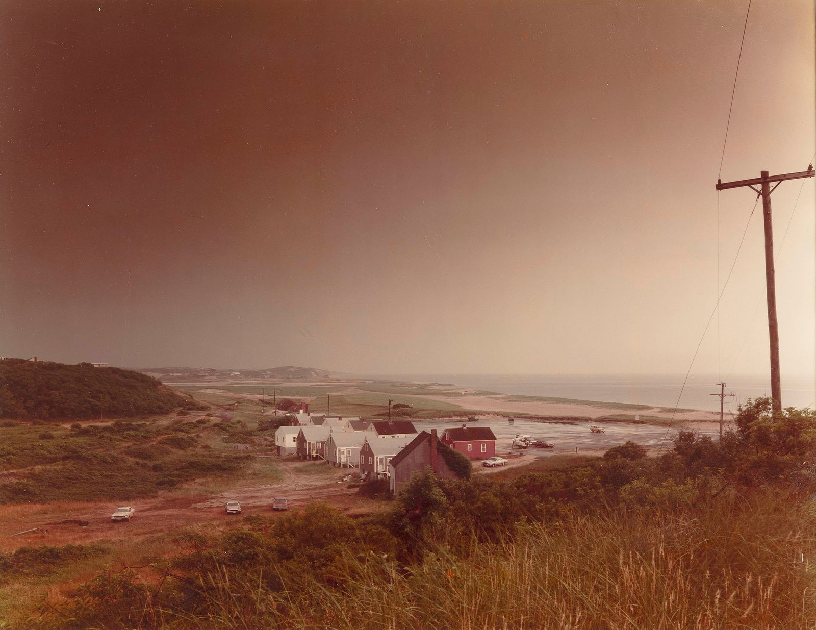 JOEL MEYEROWITZ New York/Massachusetts, 1938- "Storm Over Corn Hill Beach Truro", 1976. Signed: JOEL MEYEROWITZNew York/Massachusetts, 1938-"Storm Over Corn Hill Beach Truro", 1976. Signed "Joel Meyerowitz", titled and dated in ink verso.Chromogenic print, 15.5" x 19.5". Framed 18" x 22.25".