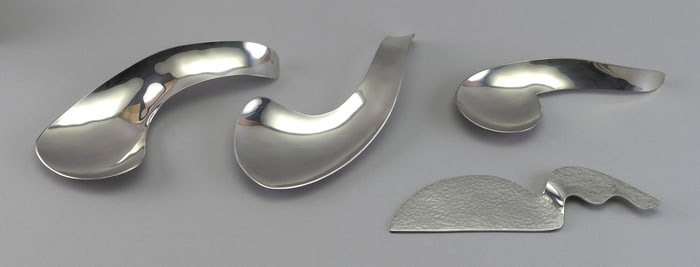 FOUR SHIRLEY CHARRON (AMERICA, 1935-2021) MODERNIST SILVER METAL SERVING PIECES Circa 1970s