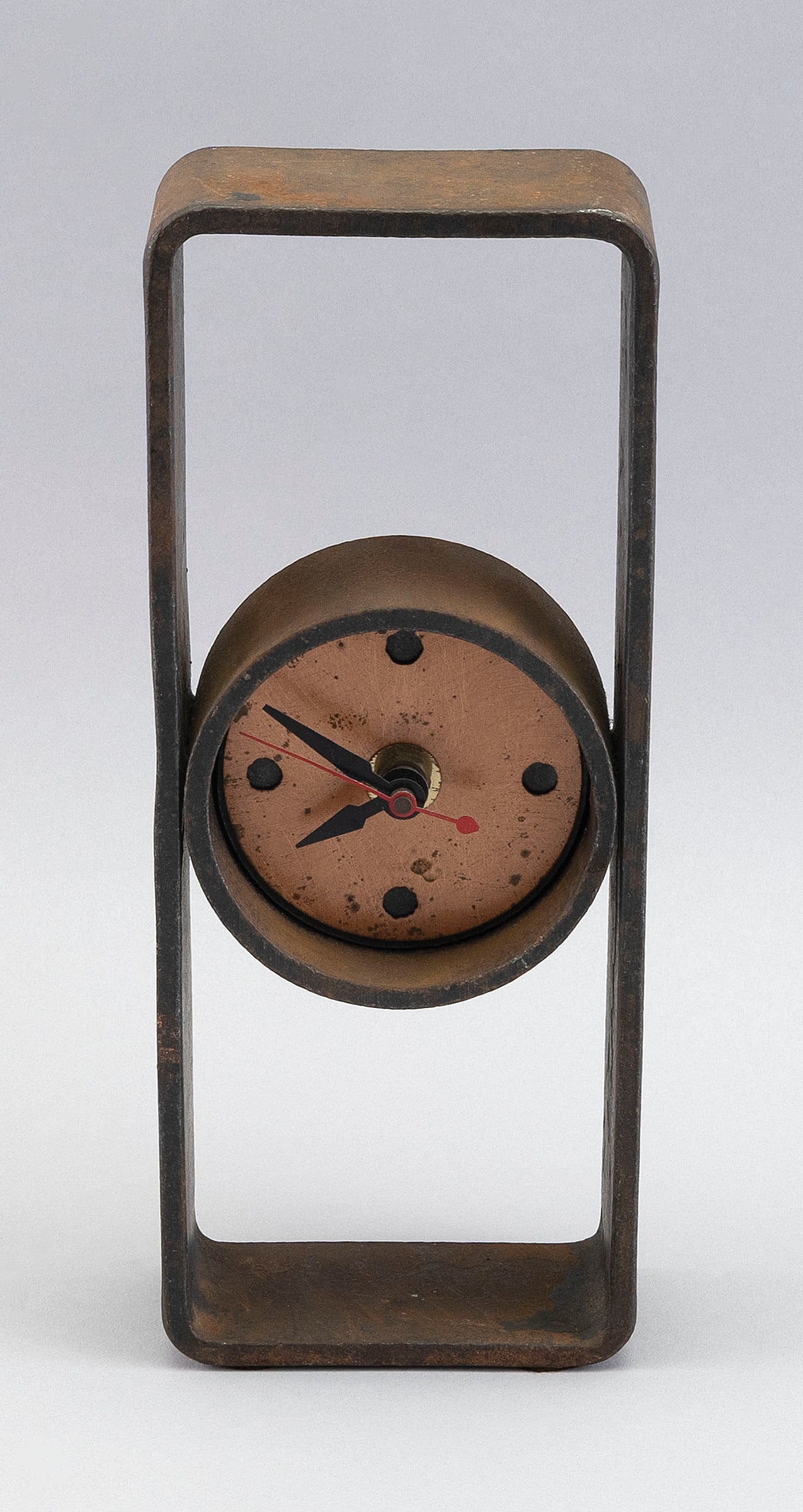 FORGED IRON MANTEL CLOCK 20th Century Height 10".: FORGED IRON MANTEL CLOCK20th CenturyAttributed to Steven Bronstein, Blackthorne Forge, Marshfield, Vermont. Copper-tone face with contrasting dot quarter-hour markers. Apparently unmarked.Height 10".