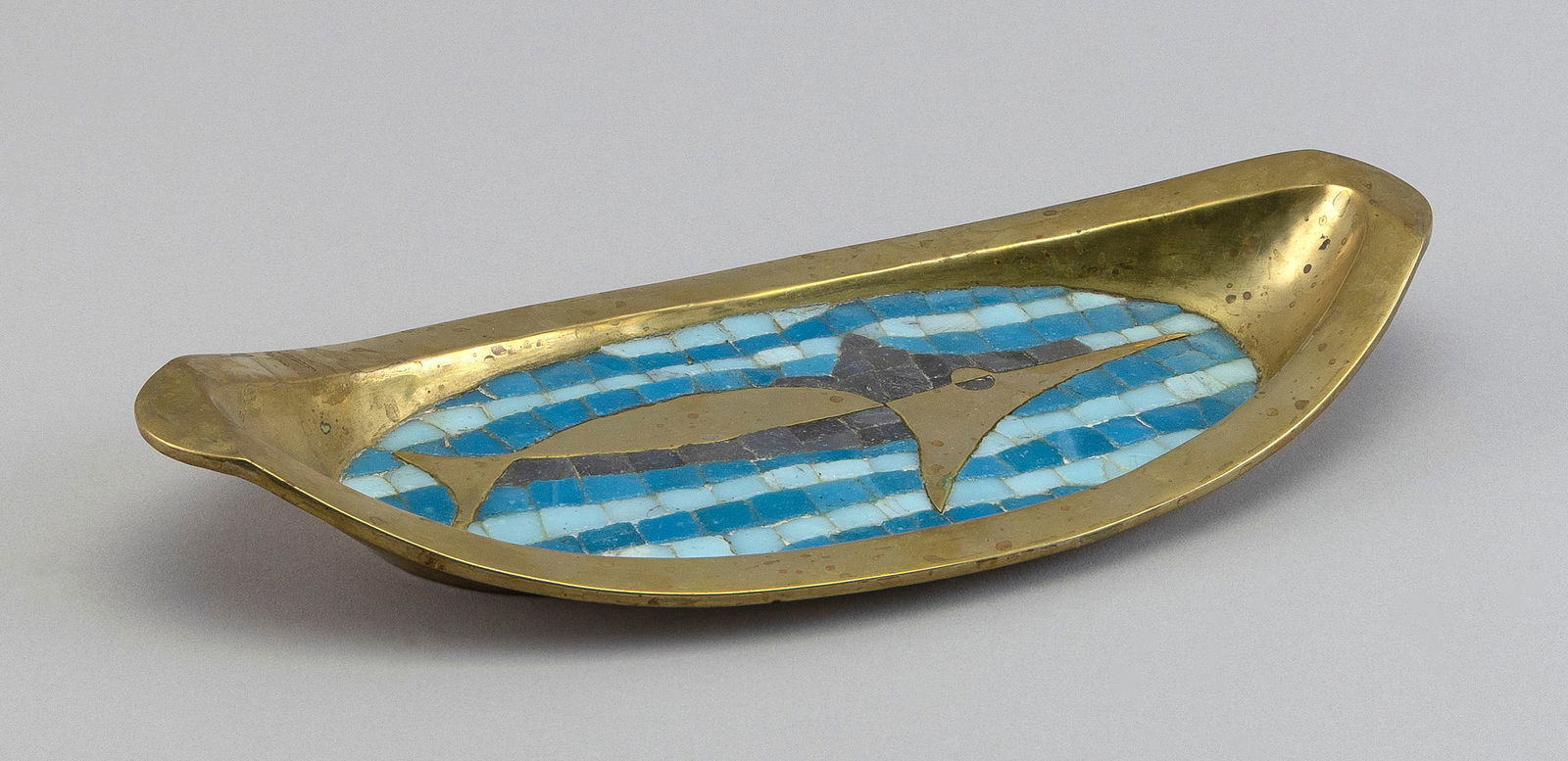 SALVADOR TERAN (Mexico, 1920-1974), Fish design tray., Brass and mosaic glass, length 12.5".: SALVADOR TERANMexico, 1920-1974Fish design tray. Marked on base "Hand Wrought Salvador Mexico".Brass and mosaic glass, length 12.5".