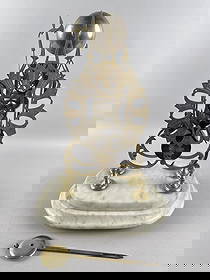 ENGLISH GOTHIC REVIVAL BRASS SKELETON CLOCK Circa 1900 Height 16". Width 11". Depth 8".: ENGLISH GOTHIC REVIVAL BRASS SKELETON CLOCKCirca 1900Fusee movement. Pierced face with etched Roman numeral dial. On a tiered marble base.Height 16". Width 11". Depth 8".