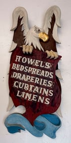 EAGLE-FORM POLYCHROMED WOODEN TRADE SIGN Mid-20th Century Height 53.5". Width 22".