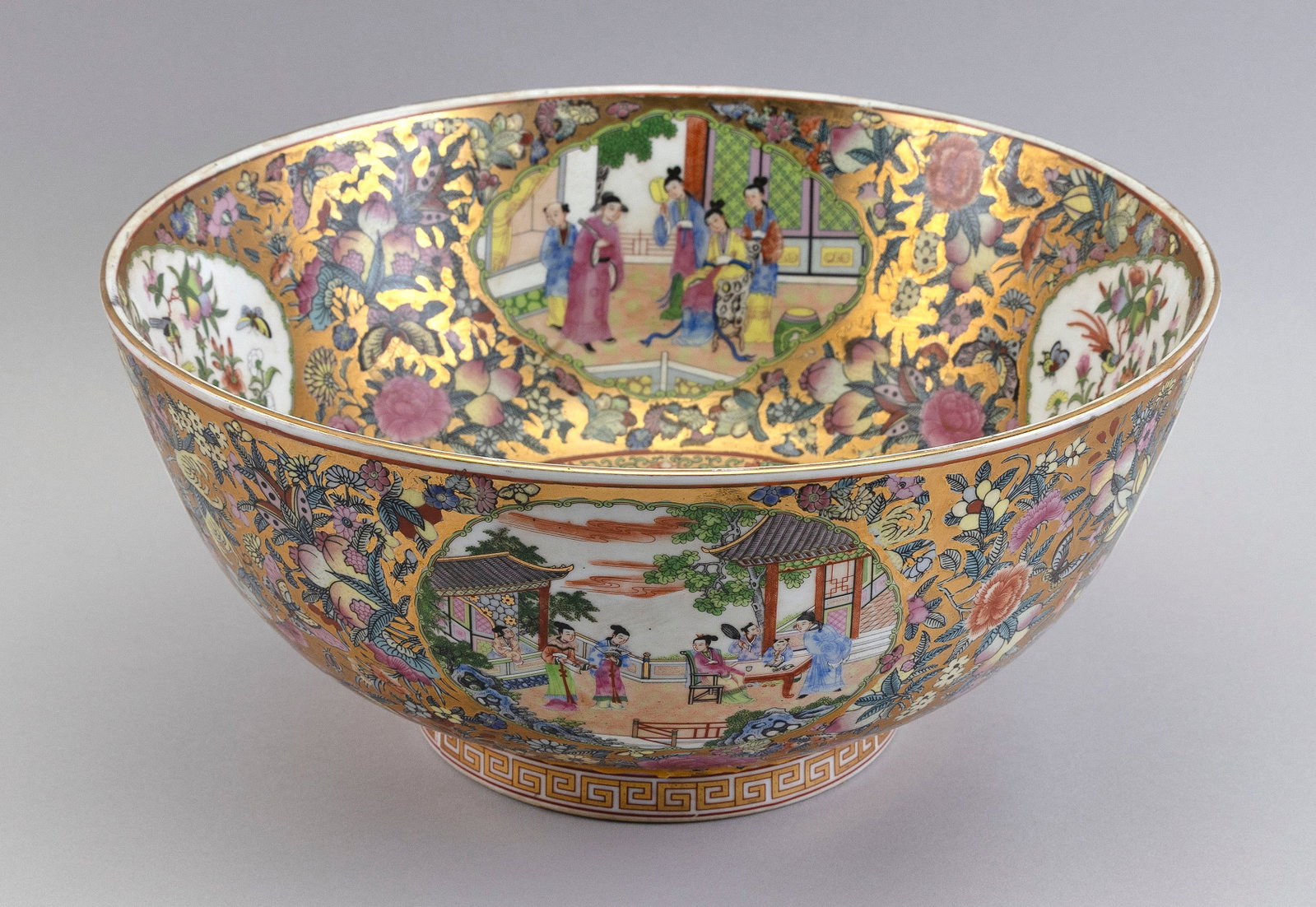 CHINESE ROSE MEDALLION PORCELAIN BOWL 20th Century Height 6.5". Diameter 14".: CHINESE ROSE MEDALLION PORCELAIN BOWL 20th Century Gilt-trimmed decoration of flowers, birds, butterflies and figural scenes. Underside with a red Qianlong Period-style mark. Height 6.5". Diameter 14"
