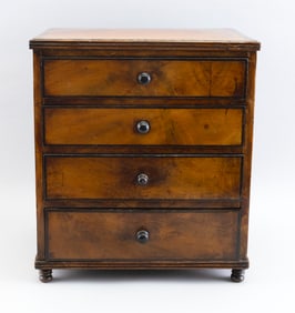 MINIATURE FOUR-DRAWER BUREAU 19th Century Height 14". Width 12.5". Depth 8.5".