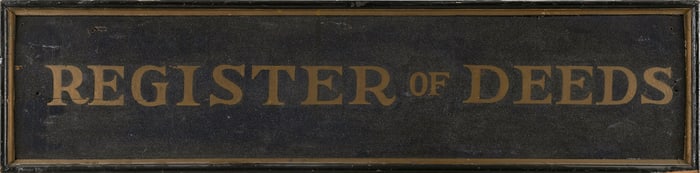 PAINTED WOODEN TRADE SIGN "REGISTER OF DEEDS" Late 19th/20th Century Height 12". Length 48.5".