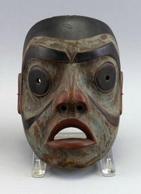 NORTHWEST COASTAL CARVED WOODEN STORYTELLER'S MASK First Quarter of the 20th Century Height 8.75".