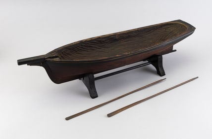 CARVED WOODEN MODEL OF A SAILING VESSEL Late 19th/Early 20th Century Model height 4.25". Length 24".