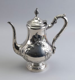 STERLING SILVER TEAPOT WITH FLORAL REPOUSS? DECORATION America, 19th Century Approx. 23.2 troy oz.