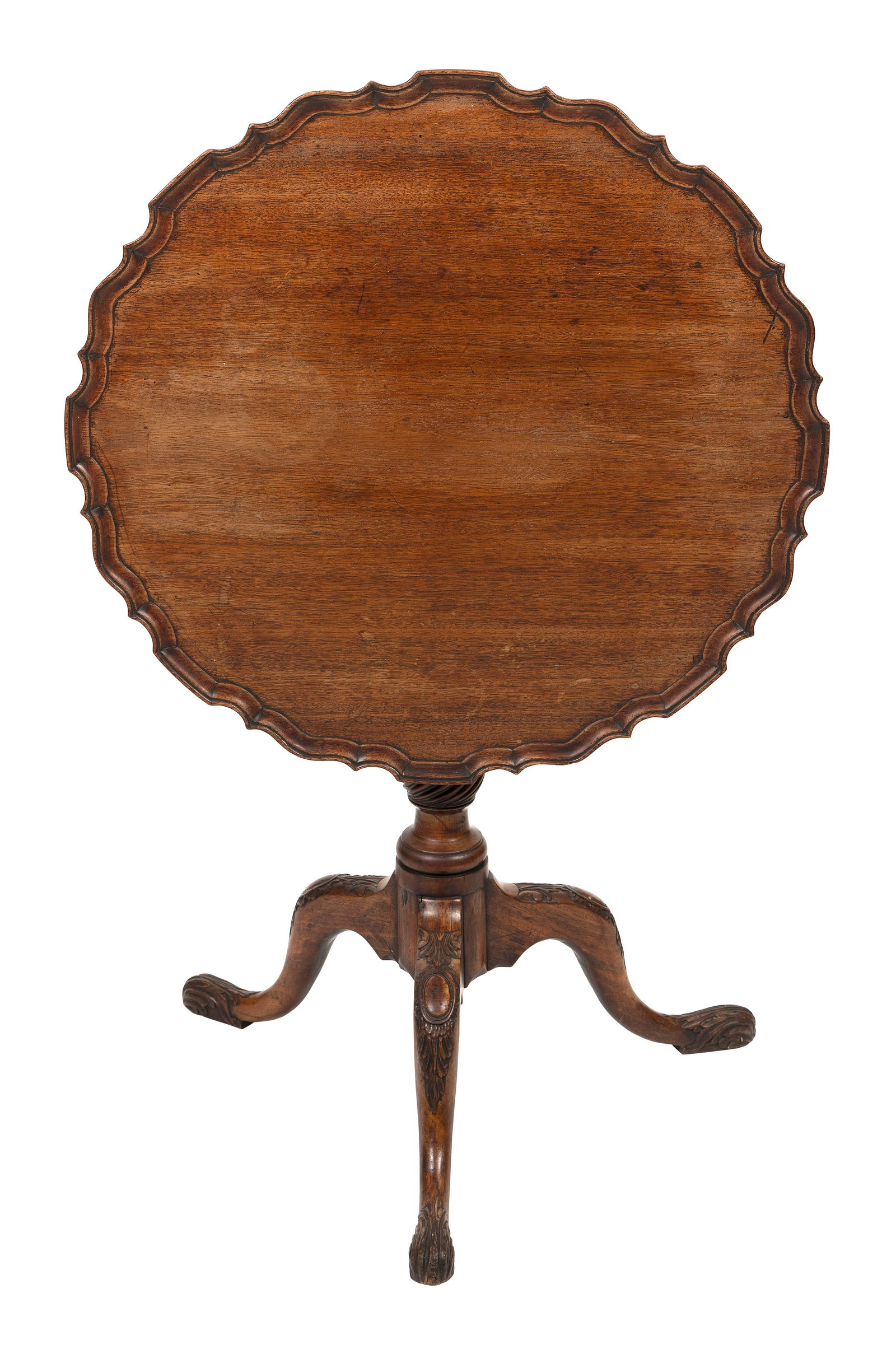 CHIPPENDALE MAHOGANY TILT-TOP TABLE 18th Century Height 27". Top diameter 27".: CHIPPENDALE MAHOGANY TILT-TOP TABLE18th CenturySingle-board top with piecrust edge. Pedestal with spiral-carved knop. Elaborately carved cabriole legs and pad feet.Height 27". Top diameter 27".