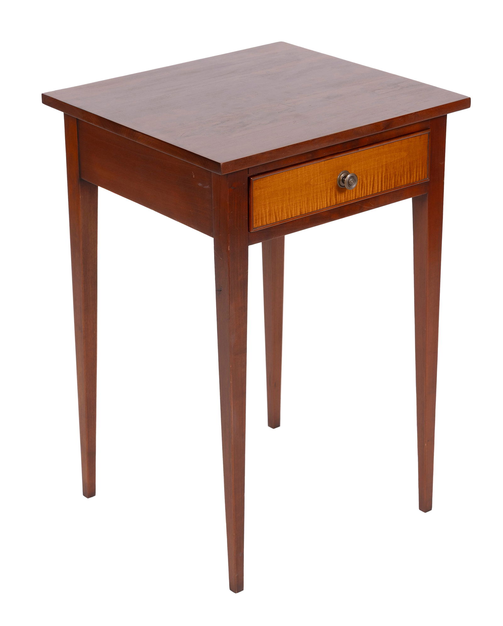 ELDRED WHEELER ONE-DRAWER STAND Massachusetts, 20th Century Height 27.5". Width 18.75". Depth 17.5".: ELDRED WHEELER ONE-DRAWER STANDMassachusetts, 20th CenturyCherry with a tiger maple drawer front. Overhanging top. Straight tapered legs.Height 27.5". Width 18.75". Depth 17.5".