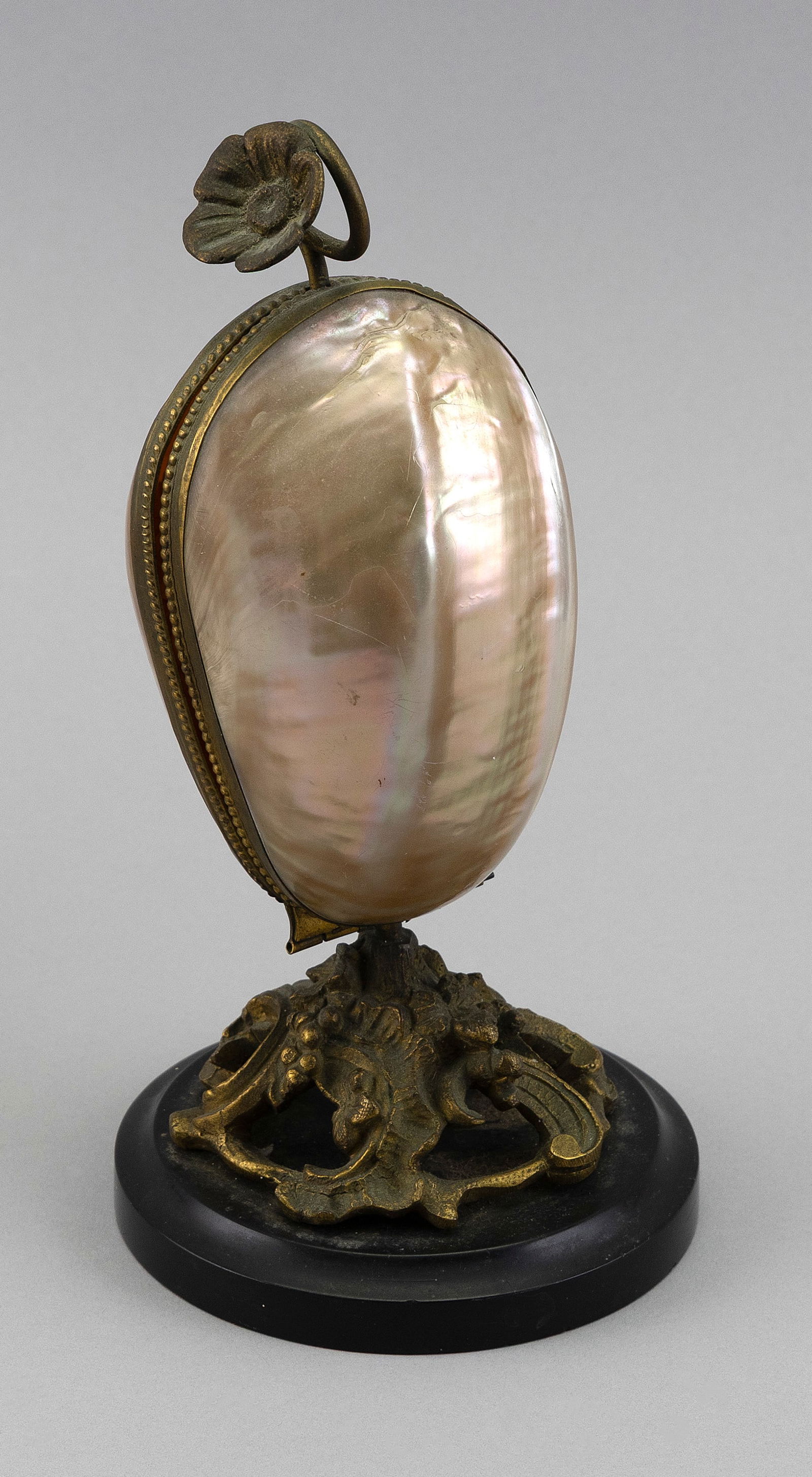 BRONZE-MOUNTED ABALONE SHELL PERFUME SET Late 19th Century Height 8.75". Base diameter 4.5".: BRONZE-MOUNTED ABALONE SHELL PERFUME SETLate 19th CenturyTwo glass perfume bottles contained within the shell. Black slate foot.Height 8.75". Base diameter 4.5".