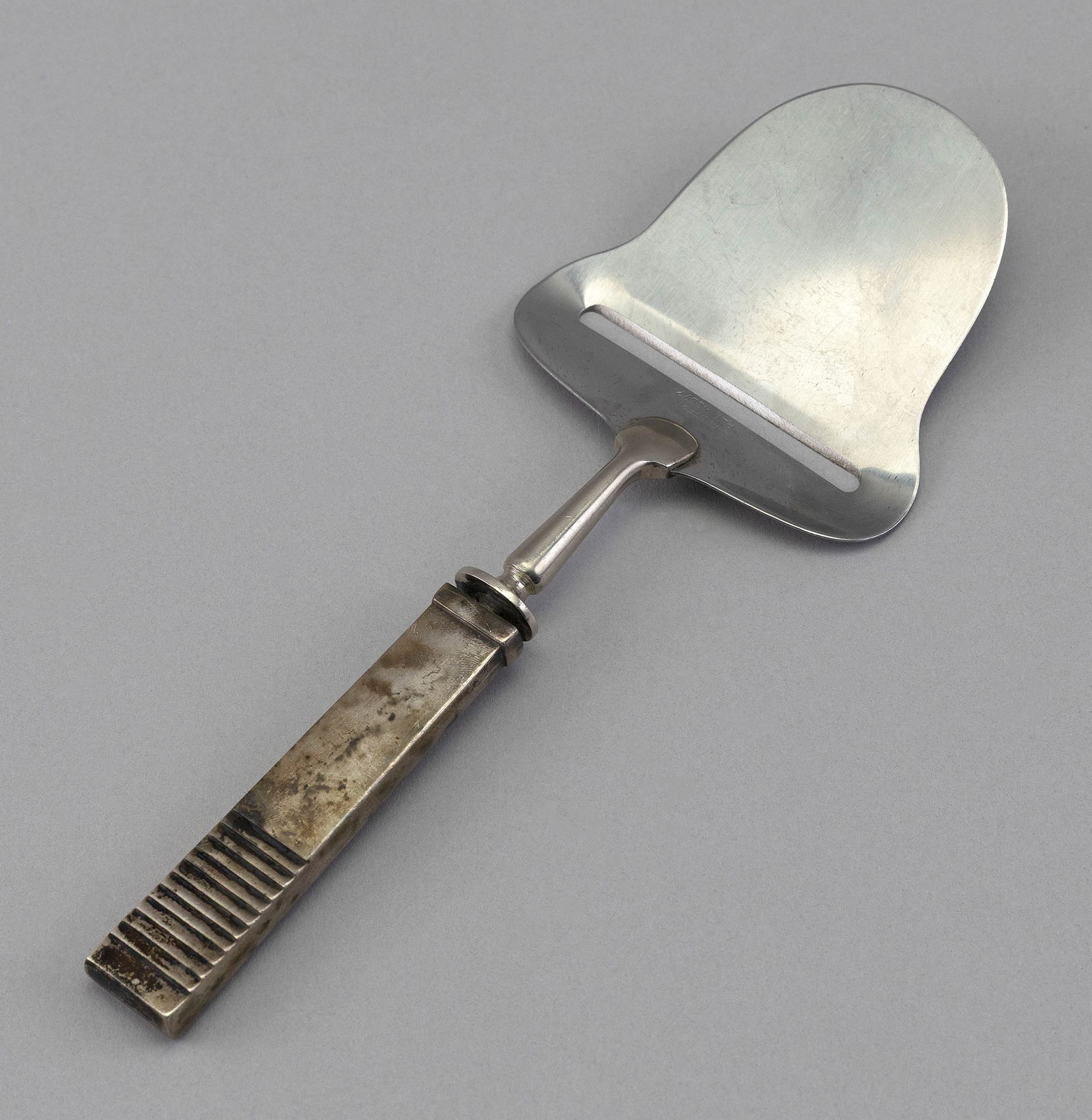 STERLING SILVER CHEESE PLANE BY GEORG JENSEN Denmark, 20th Century Length 8". (1 of 2)