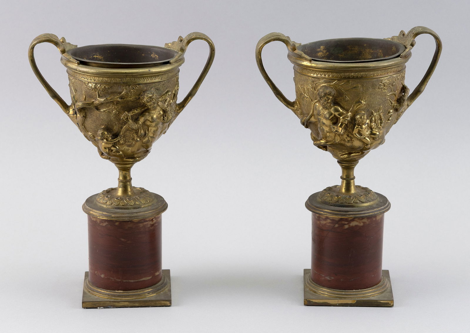 PAIR OF NEOCLASSICAL GILT BRONZE AND ROUGE MARBLE PEDESTAL URNS France, 19th Century Heights 10". (1 of 3)