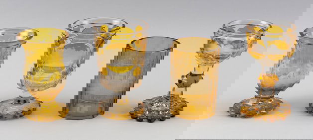 FOUR BIEDERMEIER AMBER FLASHED DRINKING GLASSES Germany/Bohemia, 19th Century Heights from 5" to