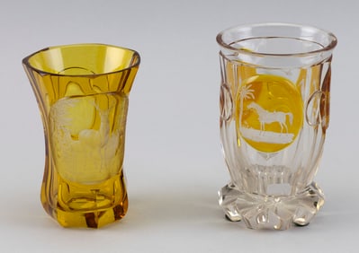 TWO BOHEMIAN BIEDERMEIER AMBER FLASHED AND ENGRAVED GLASS BEAKERS Mid-19th Century